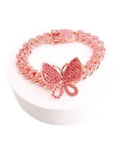 Why you'll love it: Butterfly centerpiece: A symbol of transformation, freedom and new beginnings. Fully iced design: Pink rhinestones cover every link for maximum shine. Rose gold tone: A warm, feminine finish that flatters every skin tone. Cuban link style: A trendy, bold chain that makes a statement on its own or stacked. Secure box clasp: Easy to put on and take off, with added sparkle. A gift they'll treasure: Perfect for birthdays, holidays, best friends or a sweet treat for yourself. A treasure that shines. At AngelBleu Treasures, we believe everyone deserves a little magic. This bracelet is one of those special finds that adds sparkle to every day. Add it to your treasure collection today!